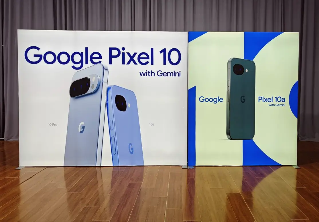Two custom tension fabric backwall displays designed by Exhibit Boss for Google, featuring full-bleed product photography of the Google Pixel 10 Pro and Pixel 10a with Gemini branding.